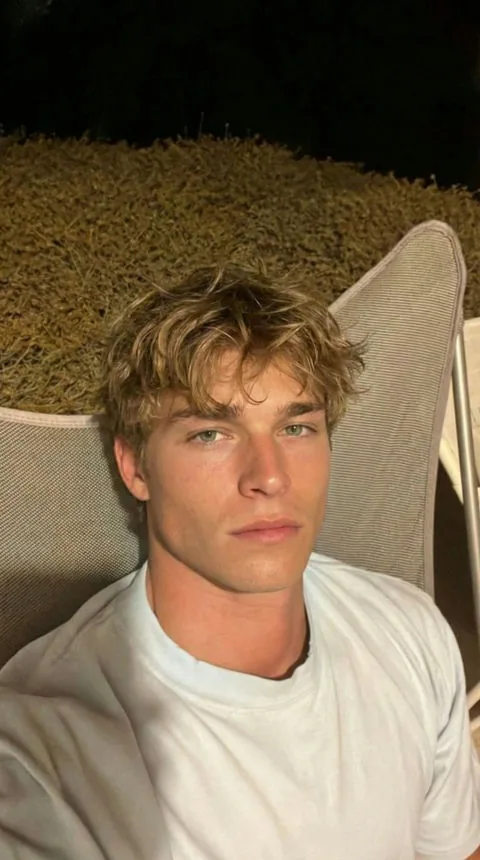 Theo, a fictional adult laid-back charmer AI companion